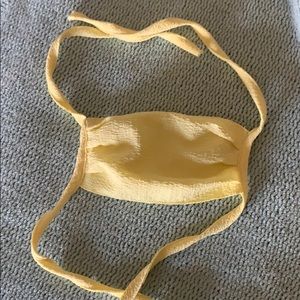 Pale yellow face mask